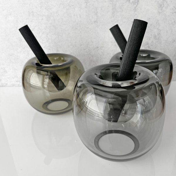 Three BÜBLE DIFFUSERS with a black stick in them, perfect for using as a fragrance diffuser from HOUSE OF GOOD.