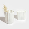 Two MELT VASE vases by ANTREI HARTIKAINEN on a white surface.