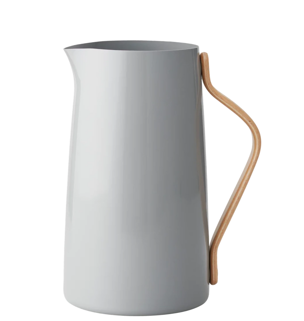 An EMMA SERVING JUG with a wooden handle on a black background.
