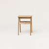 A small FORM & REFINE ANGLE FOLDABLE STOOL showcased in a Gestalt Haus setting on a white background.