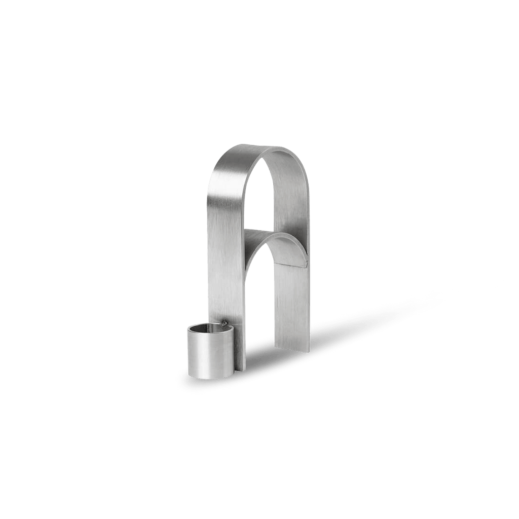 A stainless steel ARCH CANDLEHOLDER VOL. 3 by KRISTINA DAM STUDIO on a white background, inspired by Gestalt Haus design principles.