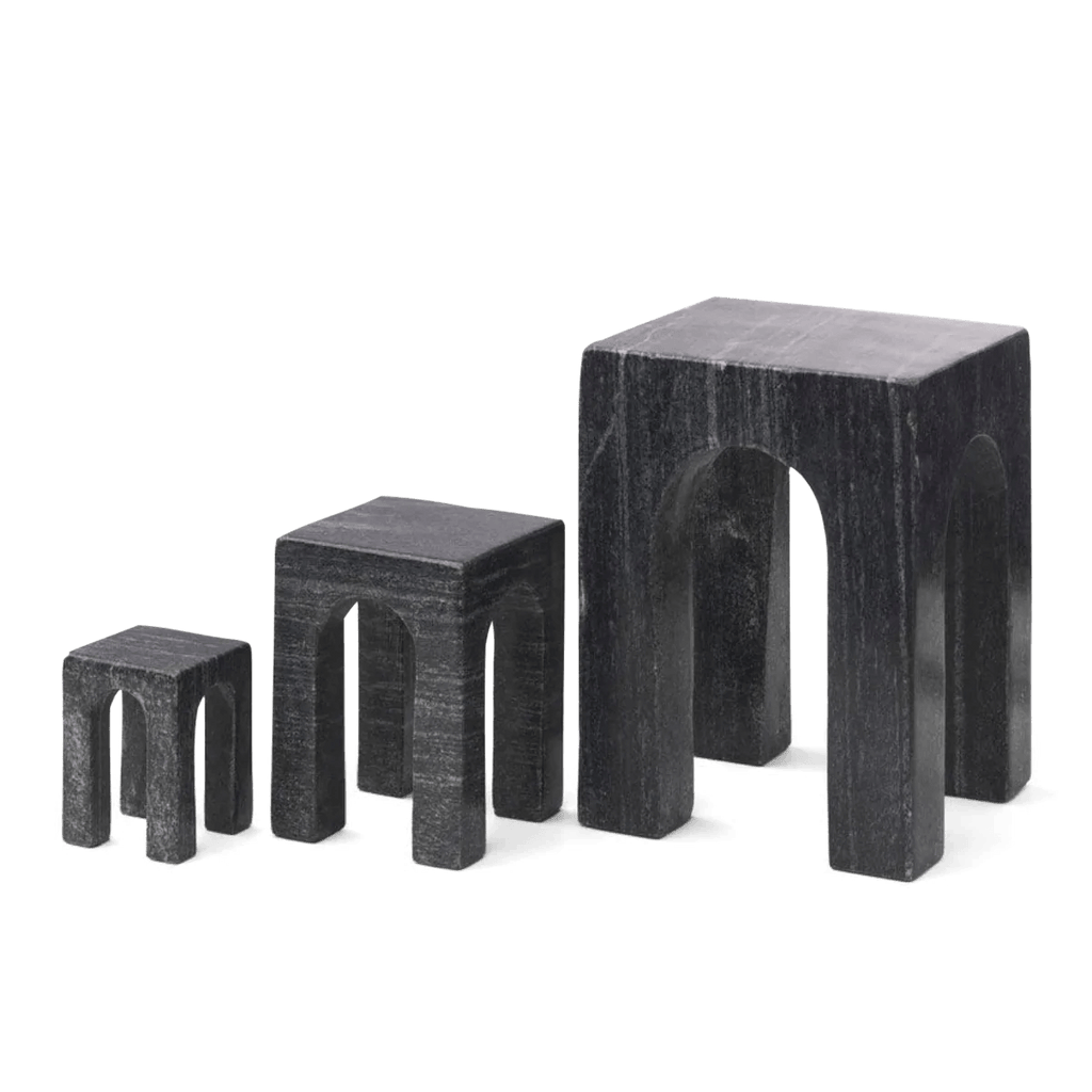 Three GEJST ARKIS MARBLE sculptures, black stools on a white background, exhibiting Gestalt Haus design principles.