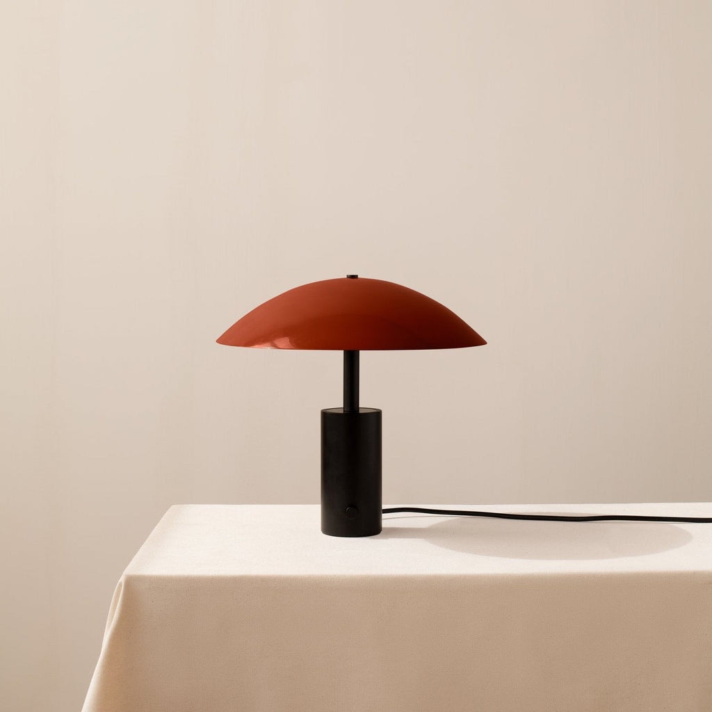 An IN COMMON WITH ARUNDEL LOW TABLE LAMP sits on a white table in a Gestalt Haus.