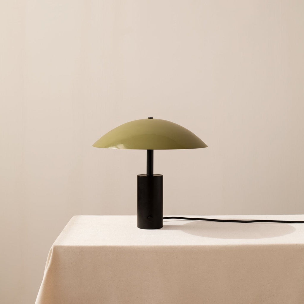A green Gestalt Haus lampshade adorning an Arundel low table.