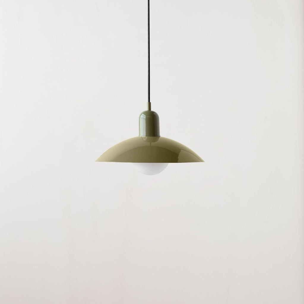 An Arundel Orb Pendant light hanging from a white wall inside the Gestalt Haus.