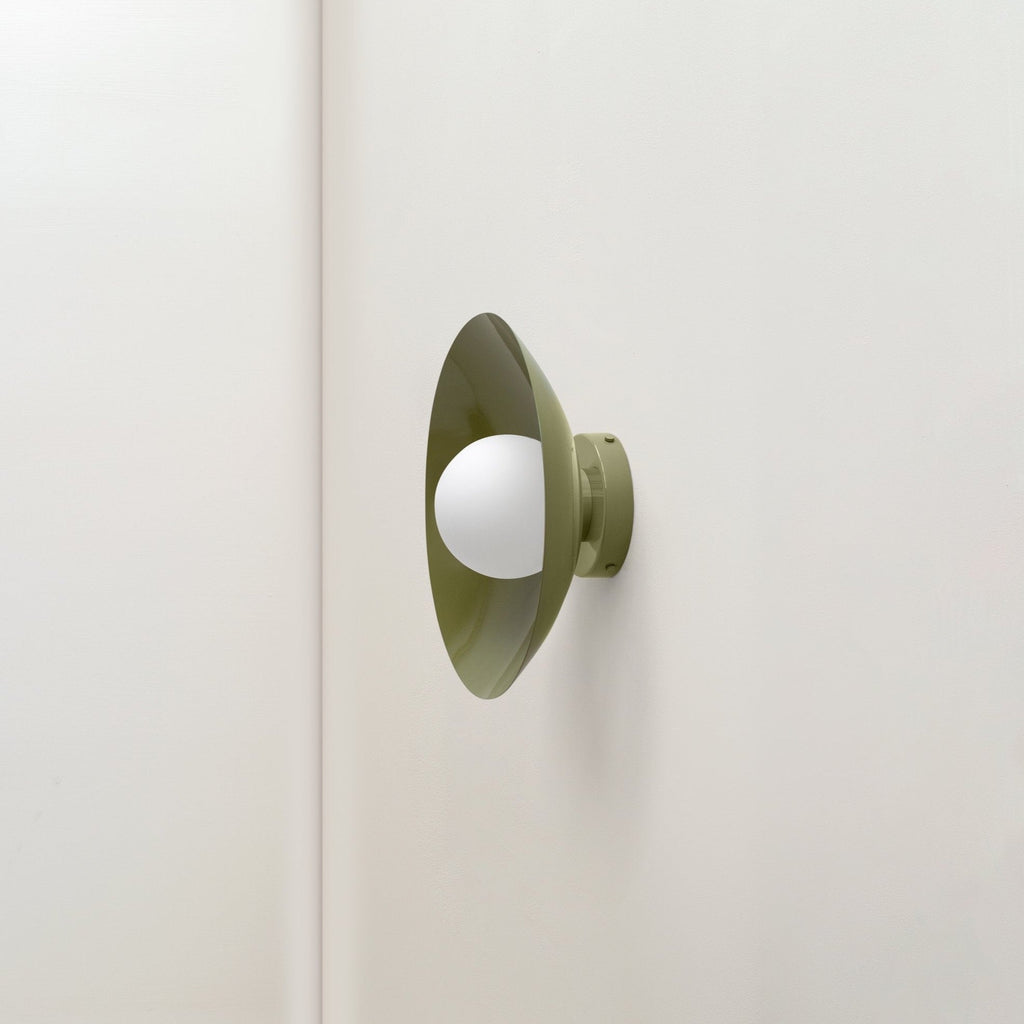 An Arundel Orb Surface Mount by In Common With on a white wall at Gestalt Haus.