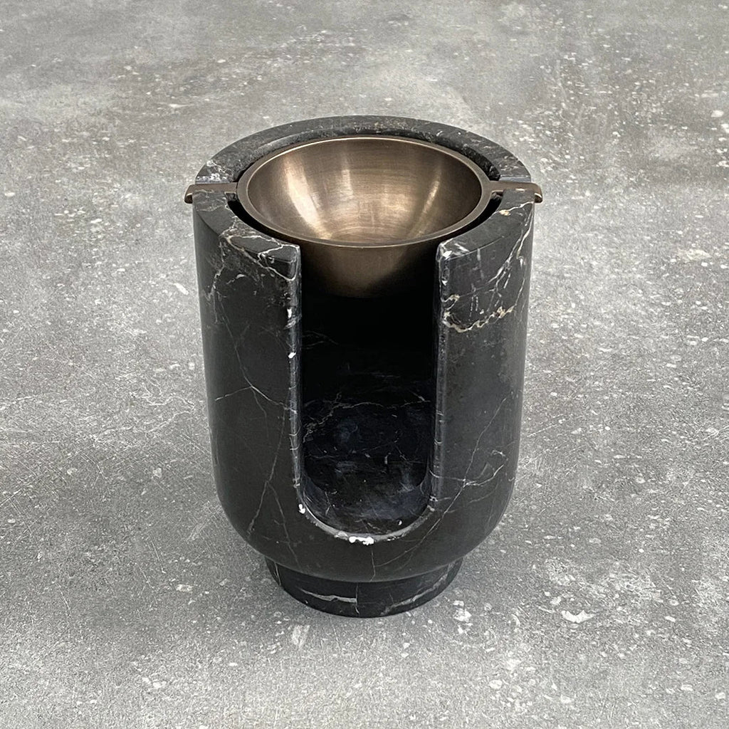An AURA OIL BURNER, made by BRANDT COLLECTIVE, sitting on top of a concrete floor at Gestalt Haus.