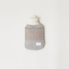 An AYMARA hot water bottle with a stripe on it by FORM & REFINE, inspired by Gestalt Haus.