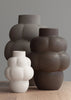 Three LOUISE ROE CERAMIC BALLOON VASE 04 GRANDE sitting on top of a wooden table at Gestalt Haus.
