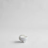 A MINI white DUCK JAR by 101 COPENHAGEN sitting on a white surface in Gestalt Haus.