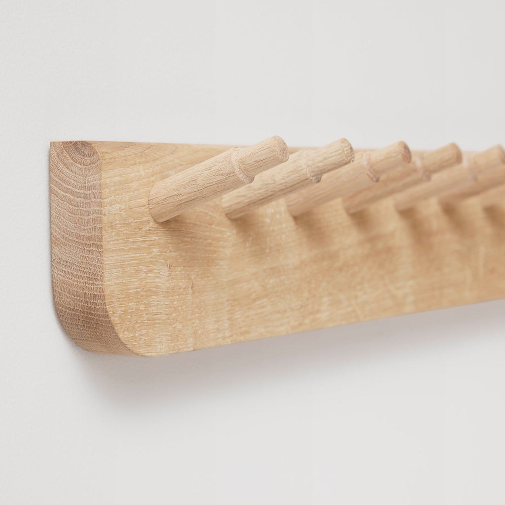 An ECHO COAT RACK 88 by FORM & REFINE with four hooks inspired by Gestalt Haus design.