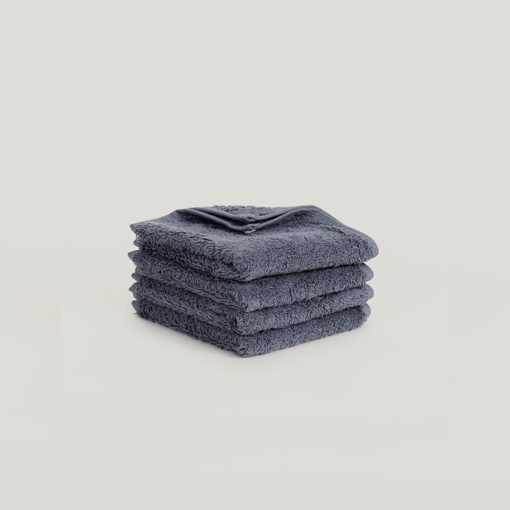 A stack of Gestalt Haus face washers on a white background.