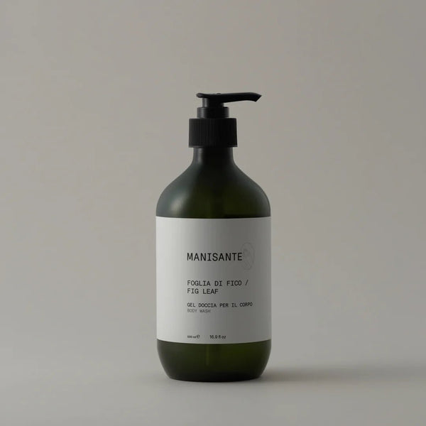 A bottle of Manisante Fig Leaf Body Wash on a white background at Gestalt Haus.