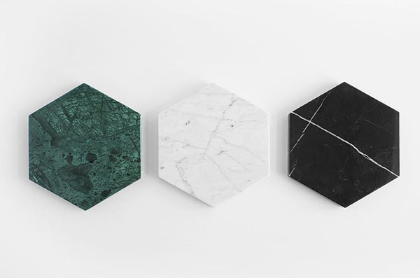 Three HEXAGON MARBLE TRIVETs by FS OBJECTS on a white surface at Gestalt Haus.