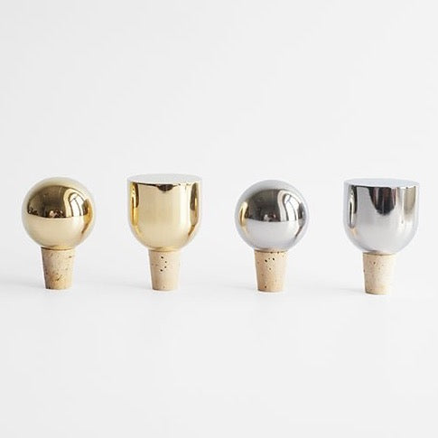 Four MASS WINE STOPPERS on a white surface at Gestalt Haus.