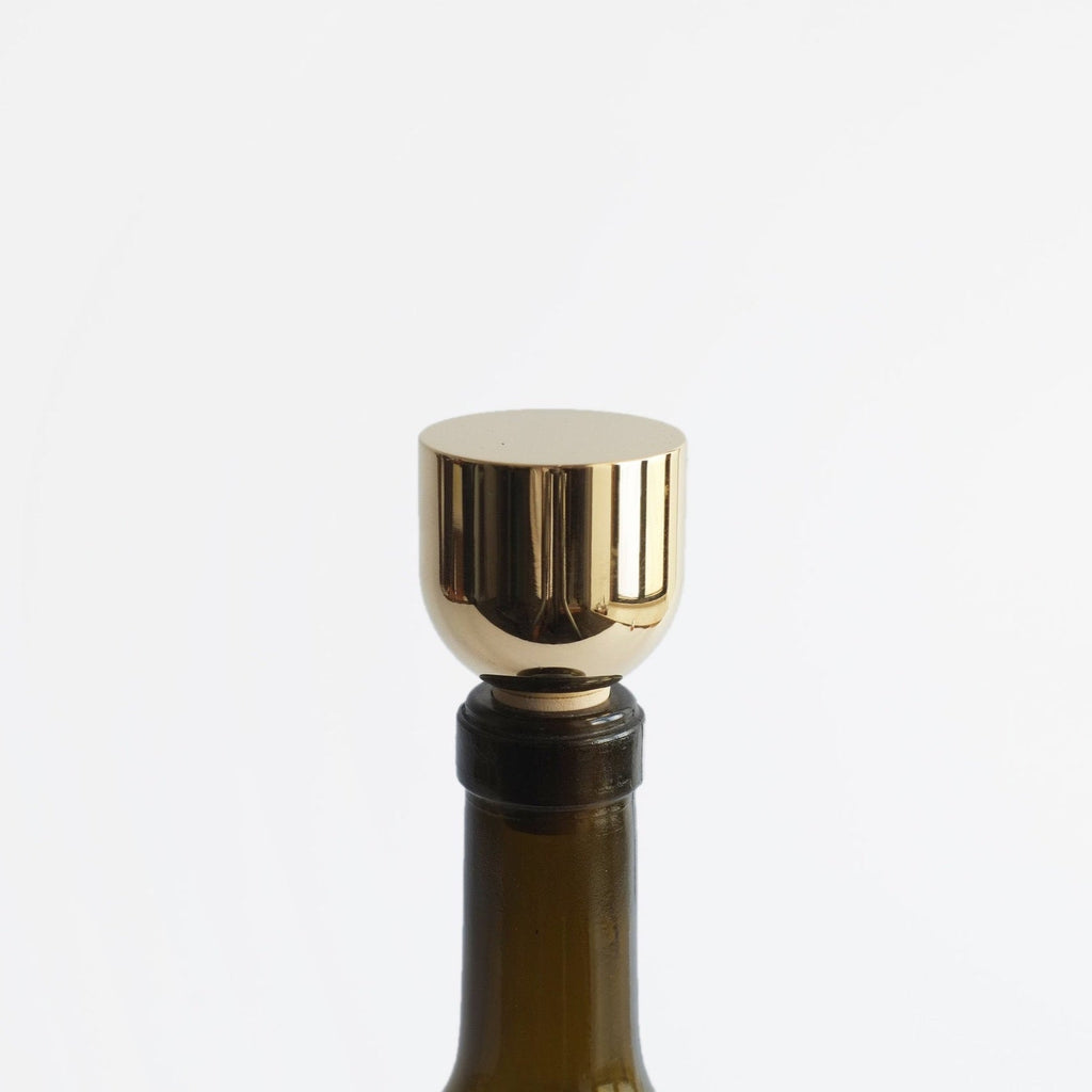 A Gestalt Haus bottle stopper on a white background.