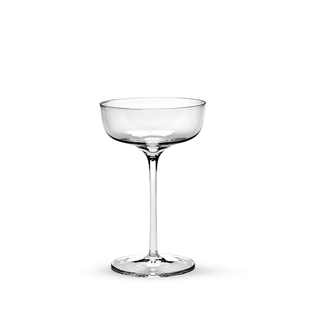 A SERAX Gestalt Haus cocktail glass on a black background