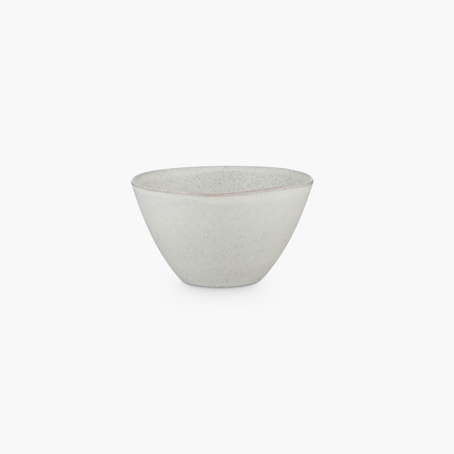A white STUDIO TABLEWARE bowl on a black background from KLASSIK STUDIO, featuring the minimalistic aesthetic of Gestalt.