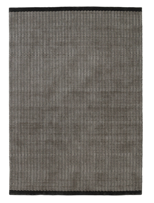 A grey and black Gestalt Rug by FABULA LIVING on a white background.