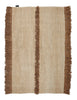 A beige Nurja rug with fringes by Sera Helsinki.