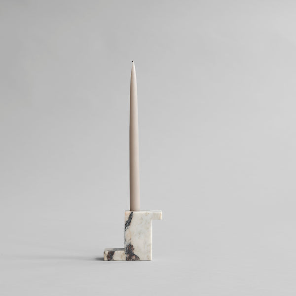 A brick candle holder with a geometric "L" design by 101 Copenhagen.