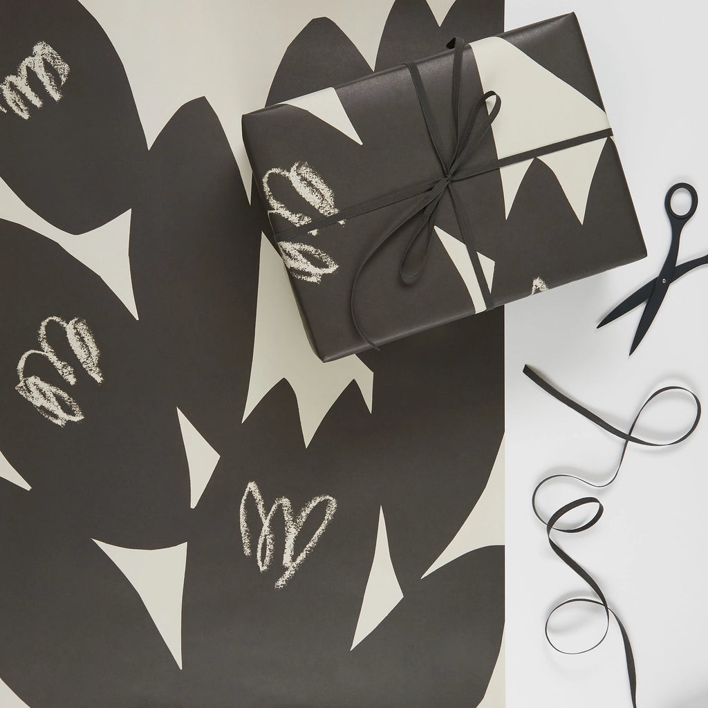 Black and white AEAND PETAL wrapping paper from KINSHIPPED.