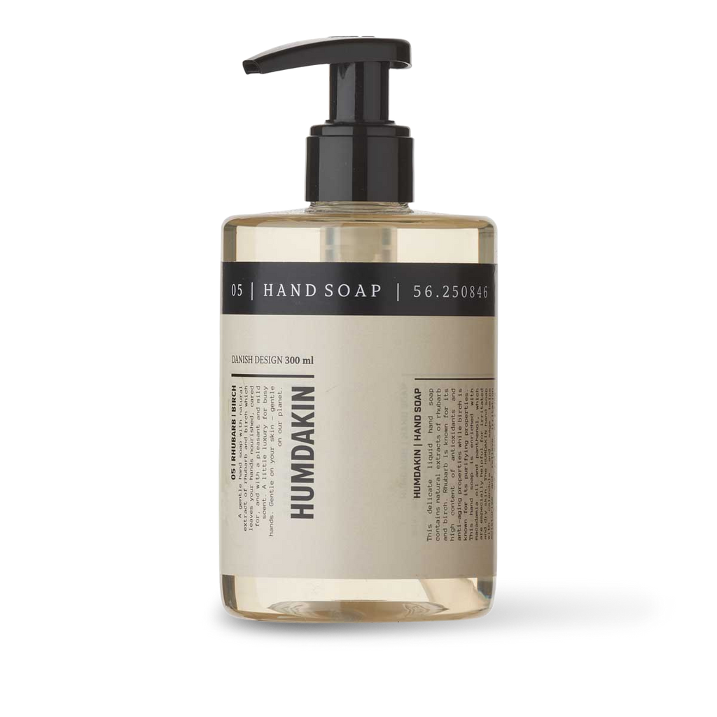 A bottle of 05 HAND SOAP RHUBARB + BIRCH by HUMDAKIN on a white background.