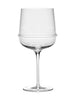 A Dune Glassware by Kelly Wearstler wine glass with ribbed detailing on a white background. (Brand: Serax)