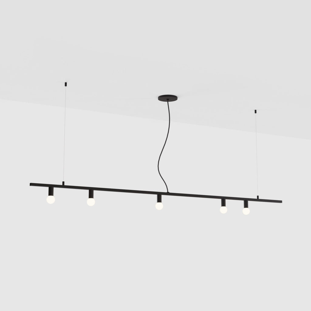 A DOT LINE SUSPENSION pendant light hanging from the ceiling, manufactured by LAMBERT ET FILS.