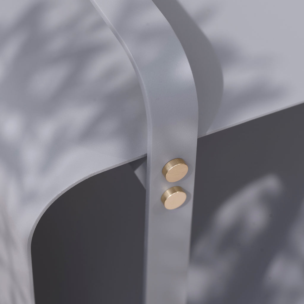 The handle of a NINNE WOOD BENCH by ELDVARM with gold buttons.