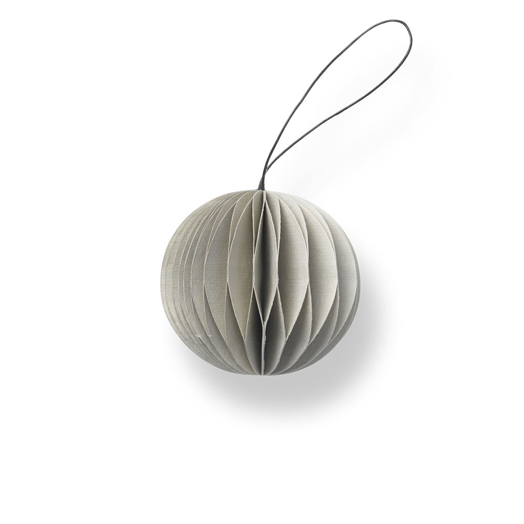 A HOLIDAY ORNAMENTS hanging from a string on a white background. (Brand: NORDSTJERNE).