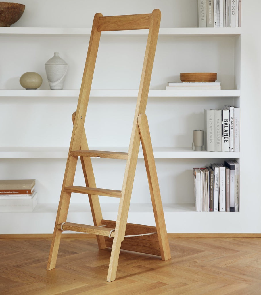 A Form & Refine STEP BY STEP LADDER in front of a bookshelf.