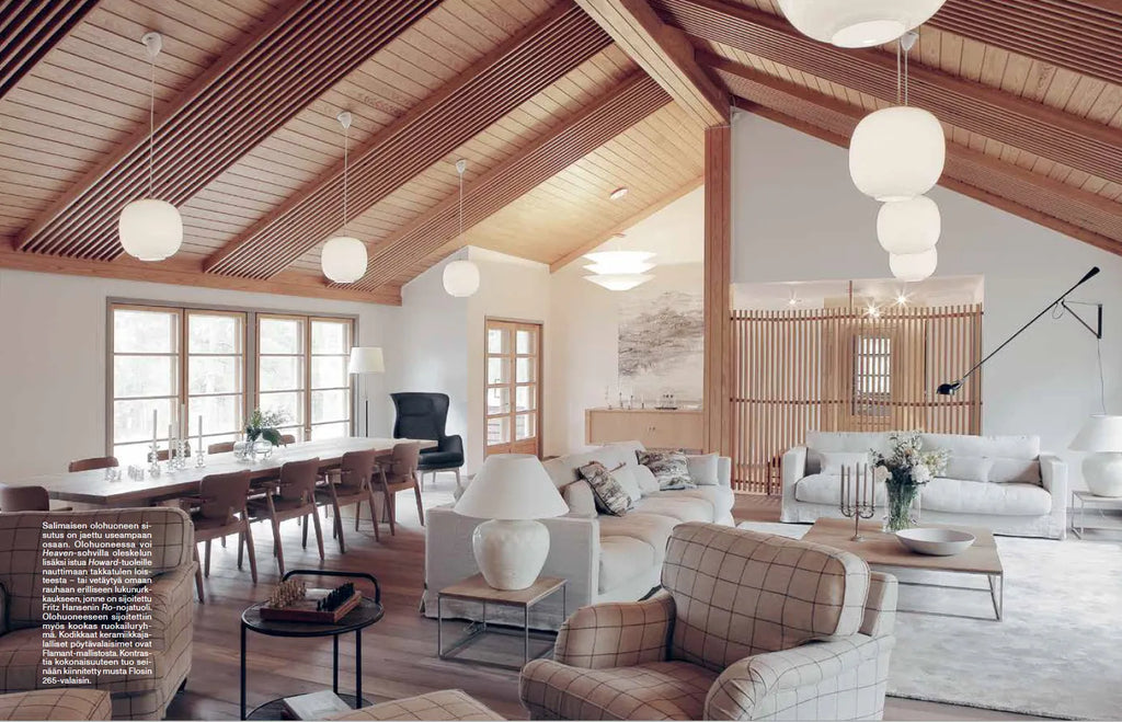 A living room with FUNKTIO wooden ceilings and COZY furniture.