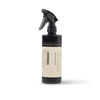 A streak-free HUMDAKIN glass cleaner bottle with a sprayer on a white background.
