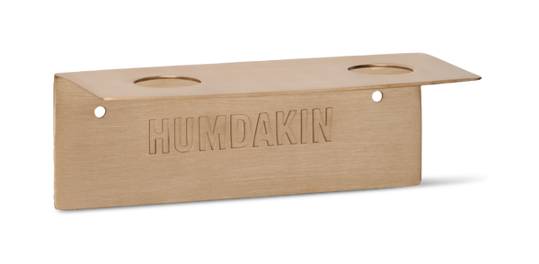 A brass plate with the word Humdakin on it, perfect as a BOTTLE HANGER DOUBLE or for holding hand sanitizer.