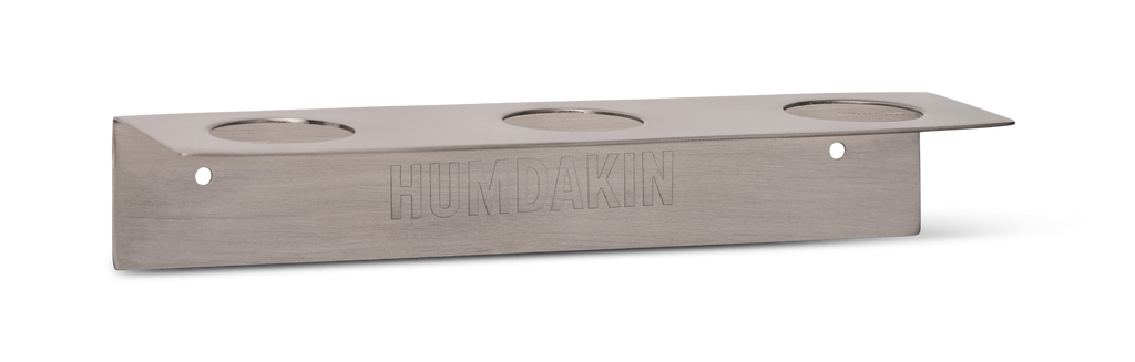 The Humdakin BOTTLE HANGER TRIPLE is a stainless steel holder for body wash, shampoo, and conditioner.
