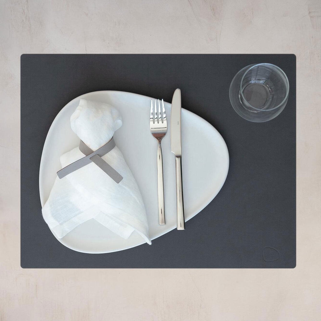 A table setting with a LIND DNA Square Dinner Mat and silverware.