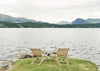 Two COZY OUTDOOR CHIC chairs on the shore of a lake in Scotland.