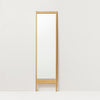 A LINE MIRROR by FORM & REFINE against a white wall.