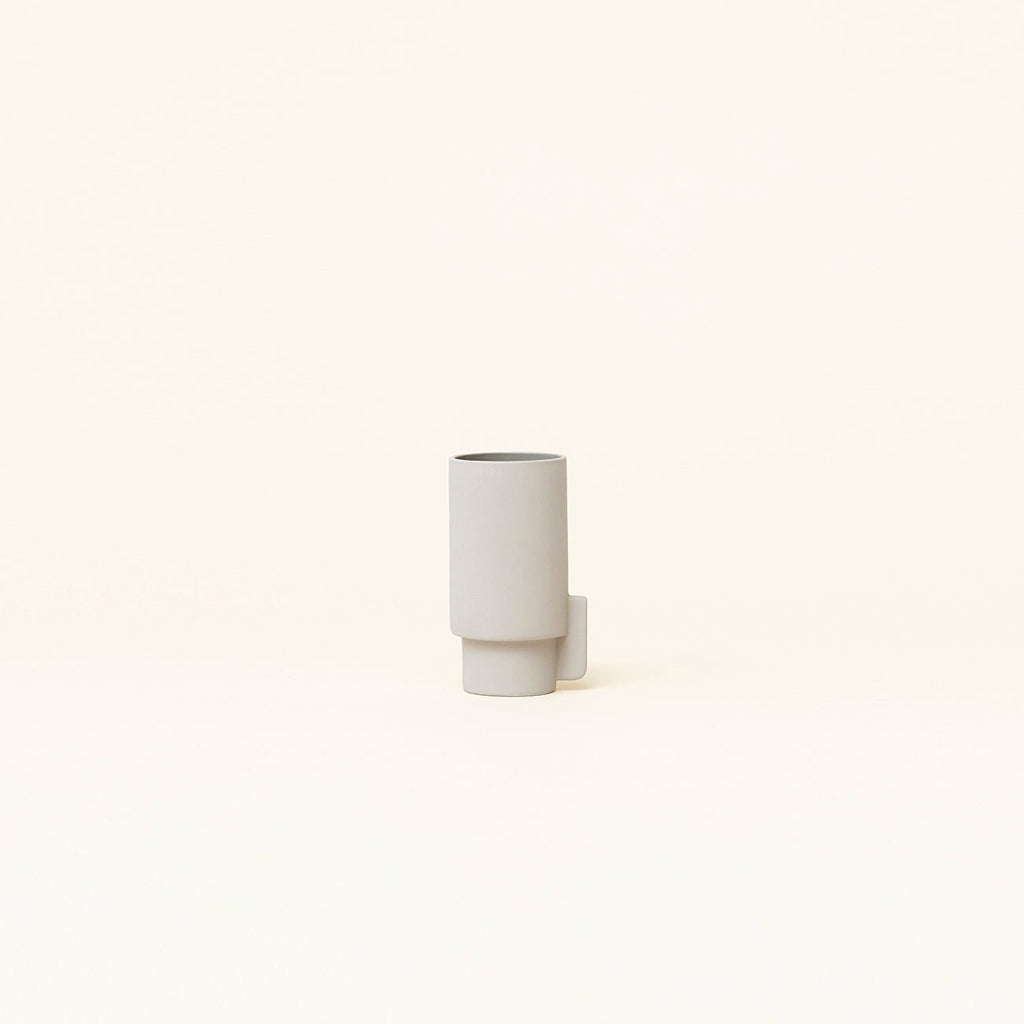 An ALCOA VASE sitting on a white surface, produced by FORM & REFINE in the Gestalt Haus style.