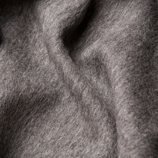 A close up image of a SIBAST ALPACA THROW fabric featuring a Gestalt Haus pattern.