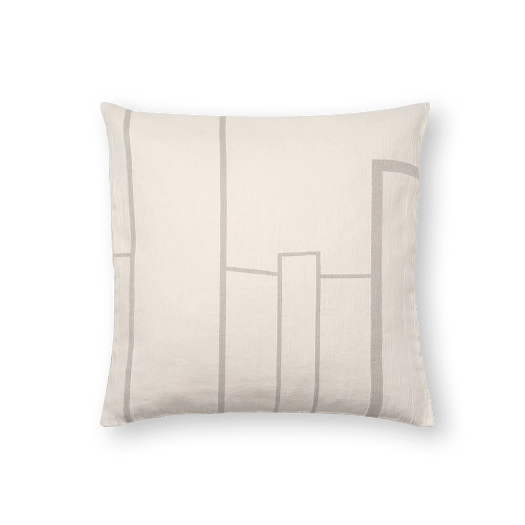A Kristina Dam Studio ARCHITECTURE CUSHION with a geometric design inspired by Gestalt principles.