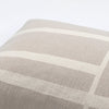 An ARCHITECTURE CUSHION with a beige and white pattern from KRISTINA DAM STUDIO.