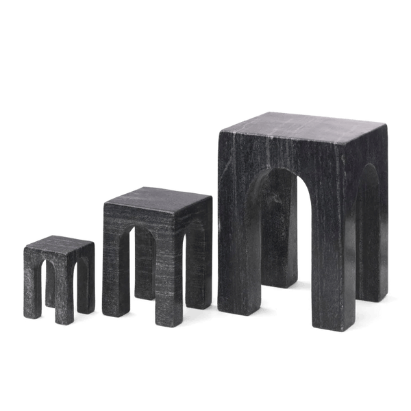 Three GEJST ARKIS MARBLE sculptures, black stools on a white background, exhibiting Gestalt Haus design principles.