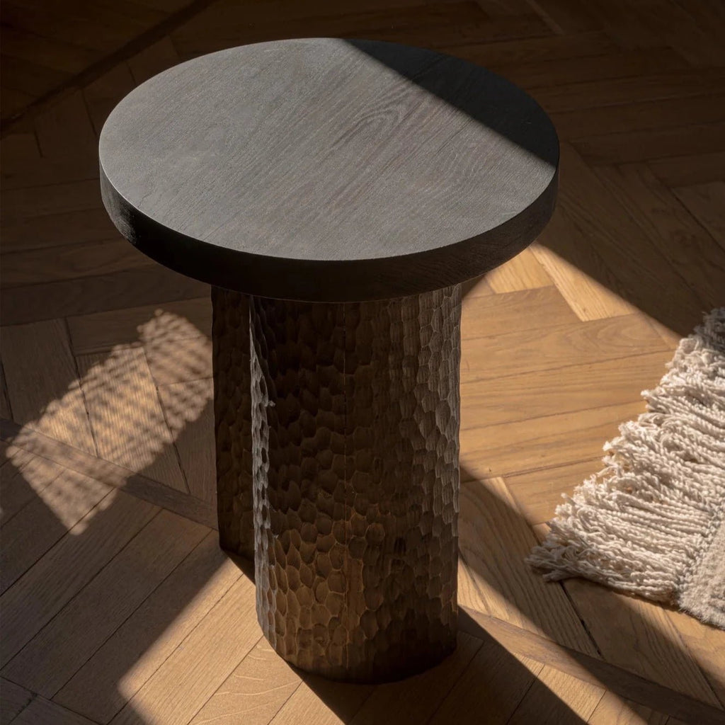 An Artesão side table on a wooden floor in Gestalt Haus.