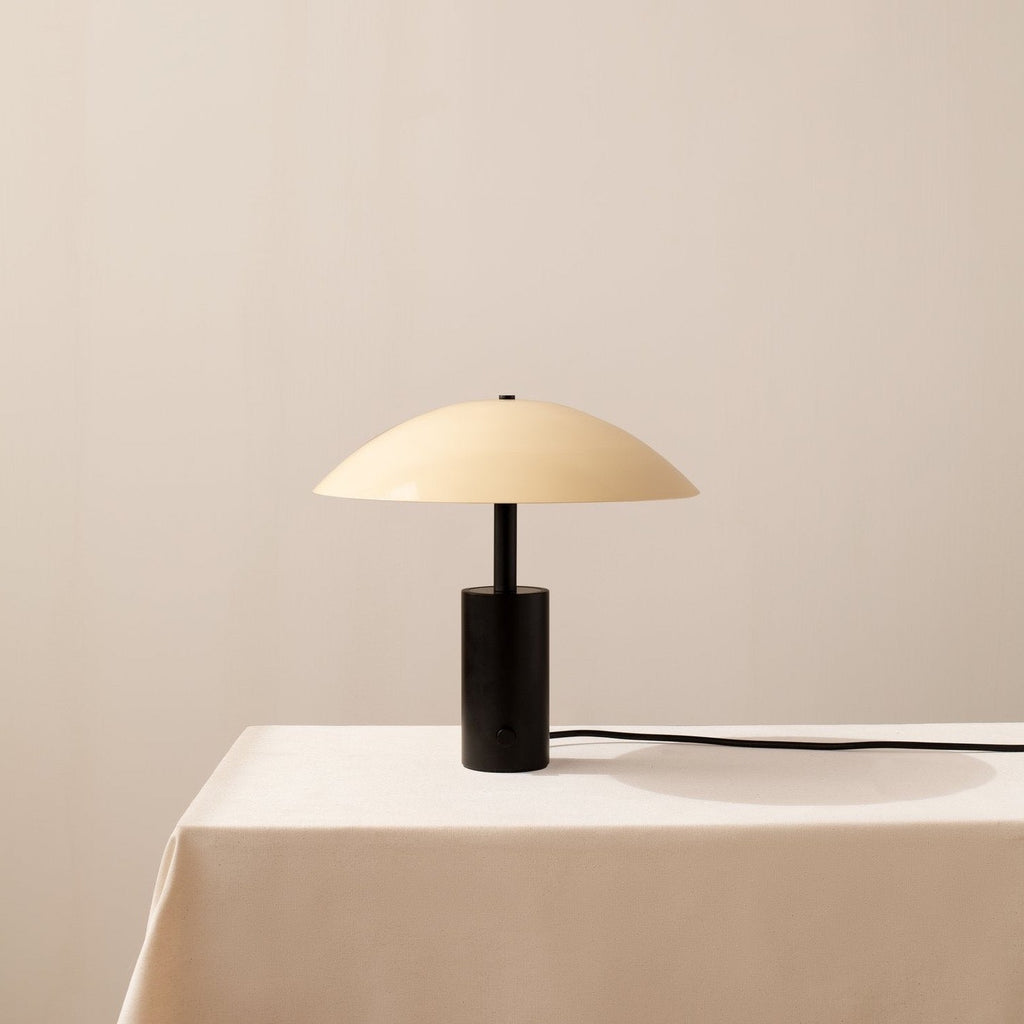 A Arundel Low Table Lamp with a black shade in a white Gestalt Haus.