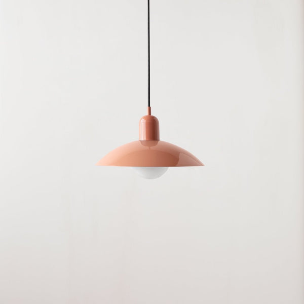 An ARUNDEL ORB PENDANT hanging from a white wall in Gestalt Haus.