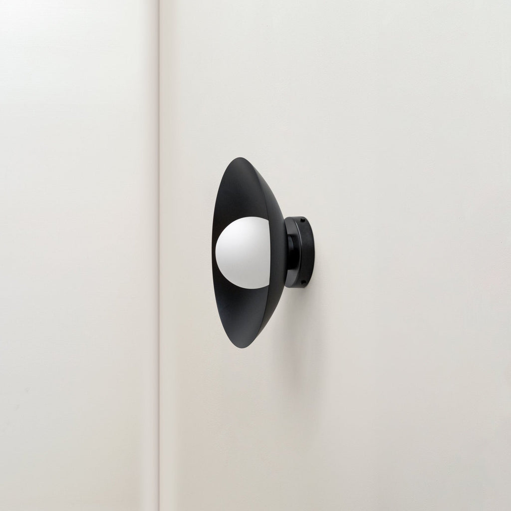 An IN COMMON WITH ARUNDEL ORB SURFACE MOUNT adorning a white wall in a Gestalt Haus.
