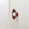 An Arundel Orb Surface Mount by Gestalt Haus on a white wall.