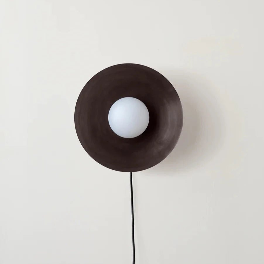An IN COMMON WITH ARUNDEL ORB SURFACE MOUNT wall lamp with a white globe on it inspired by Gestalt Haus.